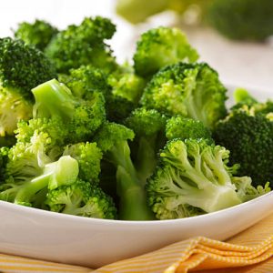 Steamed broccoli in a bowl close up