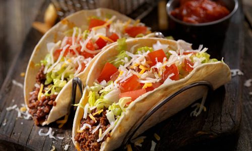 Soft Tacos With Ground Beef, Lettuce, Tomato, Onions and Cheese - Photographed on Hasselblad H3D2-39mb Camera